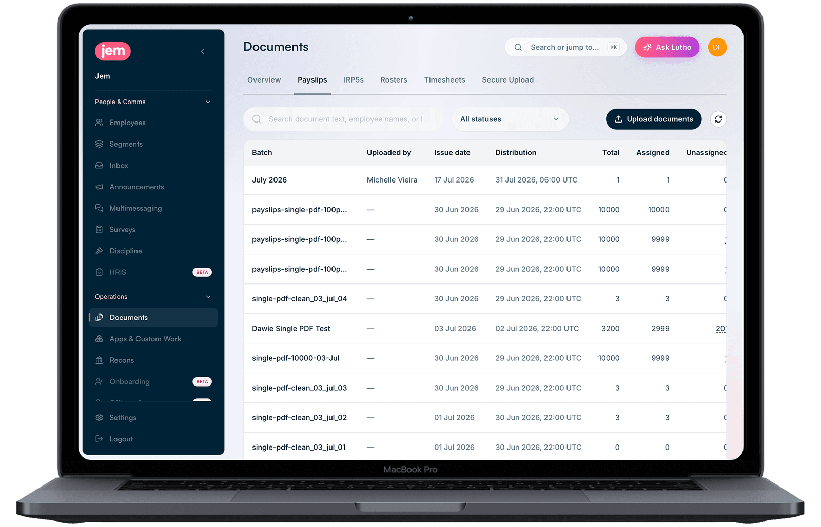 The Jem Hub open on a laptop at Documents, Payslips tab: a table of uploaded payslip batches with who uploaded each one, its issue and distribution date, and how many of the payslips are assigned or still unassigned, above an Upload documents button